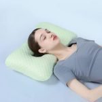 a women sleeping with piercing pillow for side sleepers