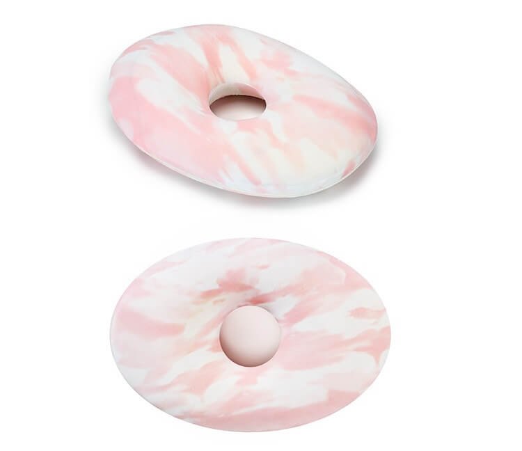 donut memory foam piercing pillow with a hole in the middle
