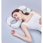 sleeping on memory foam piercing pillow with two holes